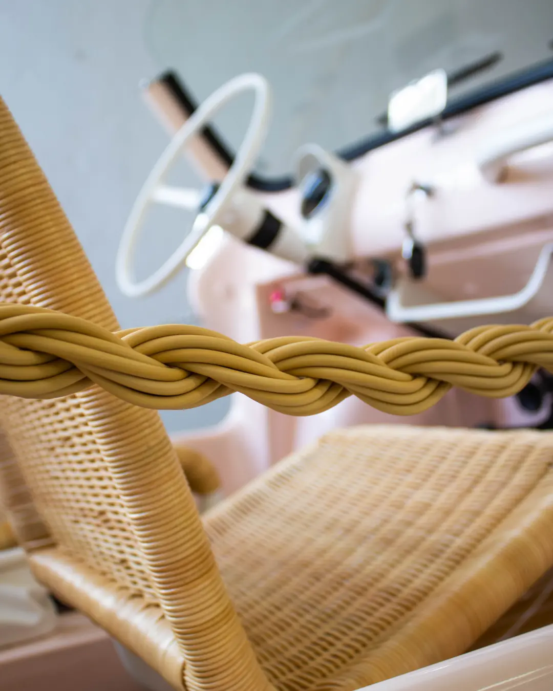Handwoven rattan seat and nautical rope detail inside LIDO