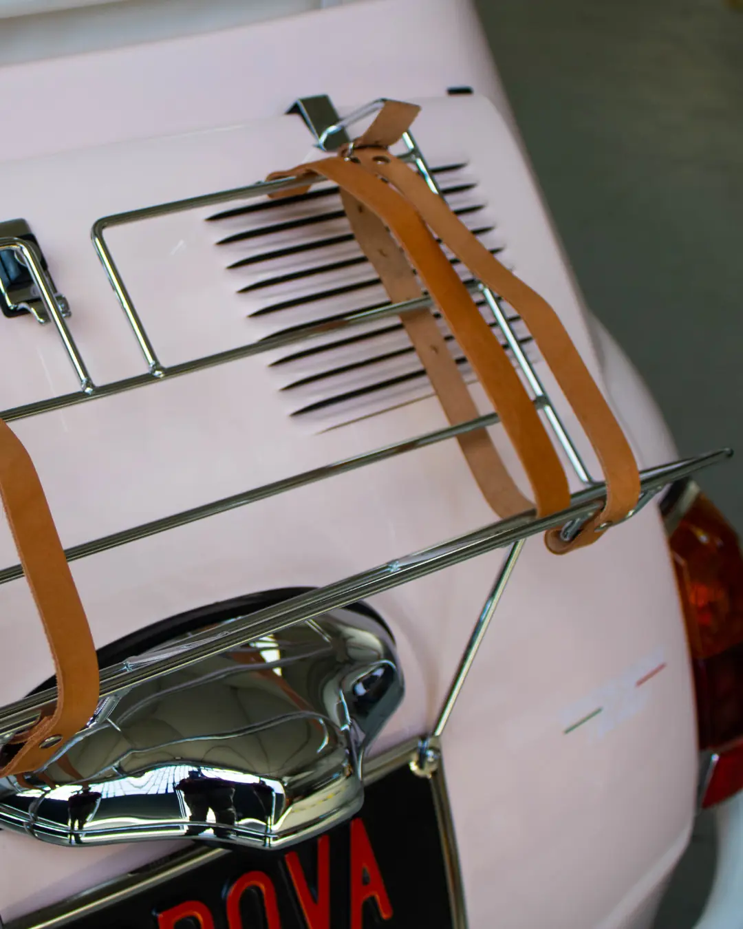 Chrome rear luggage rack with handcrafted leather straps on LIDO